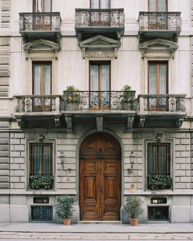 Milanese palazzo facade with tall wooden doors